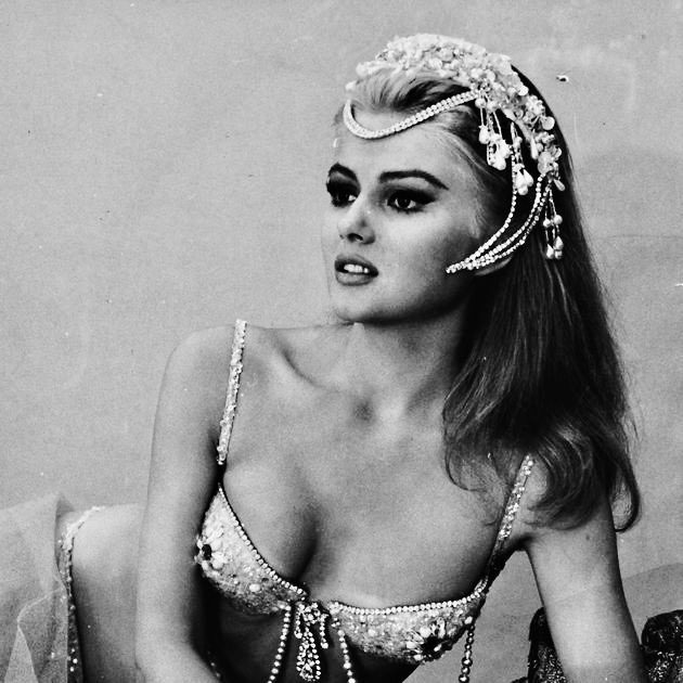 Actress Pamela Tiffin wearing a diamantine bikini and headdress as she appears in the film “Paranoia” in 1965