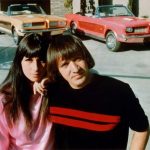 Sonny & Cher at home with their custom Ford Mustangs, 1966.