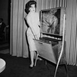 A thin flat TV screen with automatic timed recording for TV shows is the wave of the future shown at the Home Furnishings Market in Chicago, Illinois, on June 21, 1961