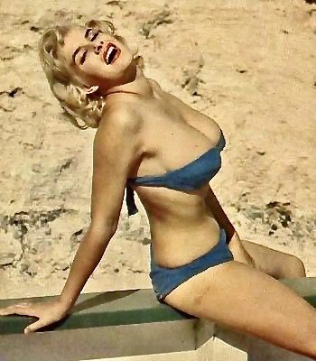 June Wilkinson still laughing in that tiny bikini
