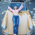 Elke Sommer laying on her Porsche 911, 1960s