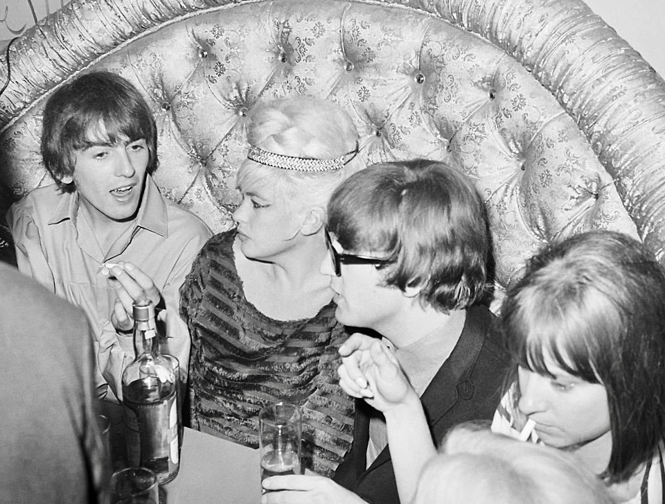 George Harrison and John Lennon chat with actress Jayne Mansfield