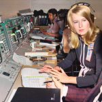 NASA Technical Specialist Frances ‘Poppy’ Northcutt speaks with a colleague in Mission Control during Apollo 11, July 1969.