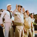 Lieutenant commander Quinton McHale (Ernest Borgnine, center), ensign Charles Parker (Tim Conway, center right) and the crew of PT-73 in this still from the TV series McHale’s Navy.