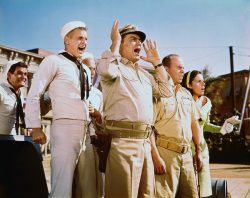 Lieutenant commander Quinton McHale (Ernest Borgnine, center), ensign Charles Parker (Tim Conway, center right) and the crew of PT-73 in this still from the TV series McHale’s Navy.