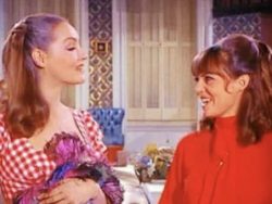 Julie Newmar made a guest appearance on Get Smart in the 1968 episode “￼The Laser Blazer,” here with Barbara Feldon as Agent 99.