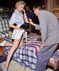 Kathleen Hughes rehearsing a scene for director Jack Arnold on the set of the 1953 film The Glass Web.