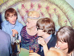 George Harrison and John Lennon chat with actress Jayne Mansfield