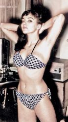 Joan Collins Checking her bikini before going outside